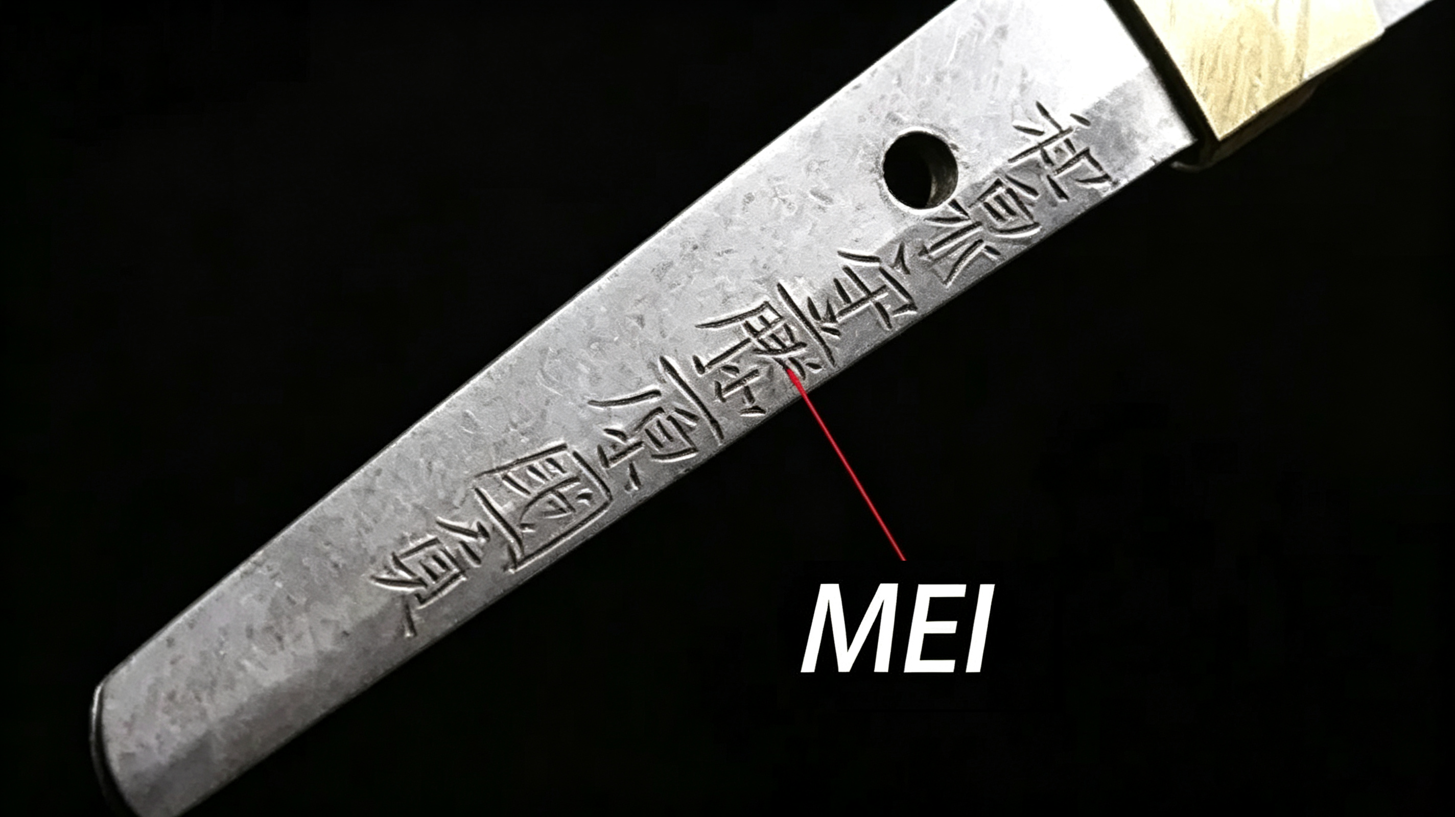 16:9 close‑up annotated photograph, mei smith signature carved on katana nakago tang