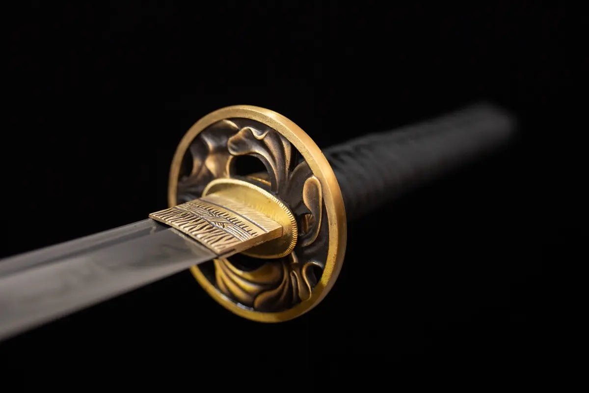 TSUBA and other accessories are made of copper and carved with the pattern of phoenix tail.