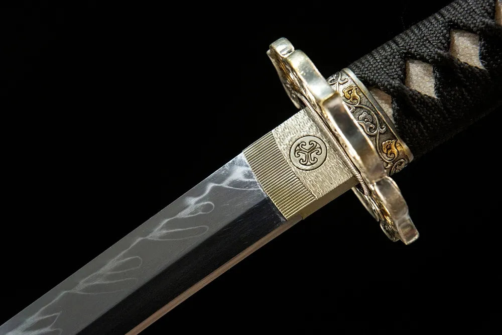 Upper blade closeup The Firmament Tachi, clear gunome hamon near solid copper habaki real yokote line