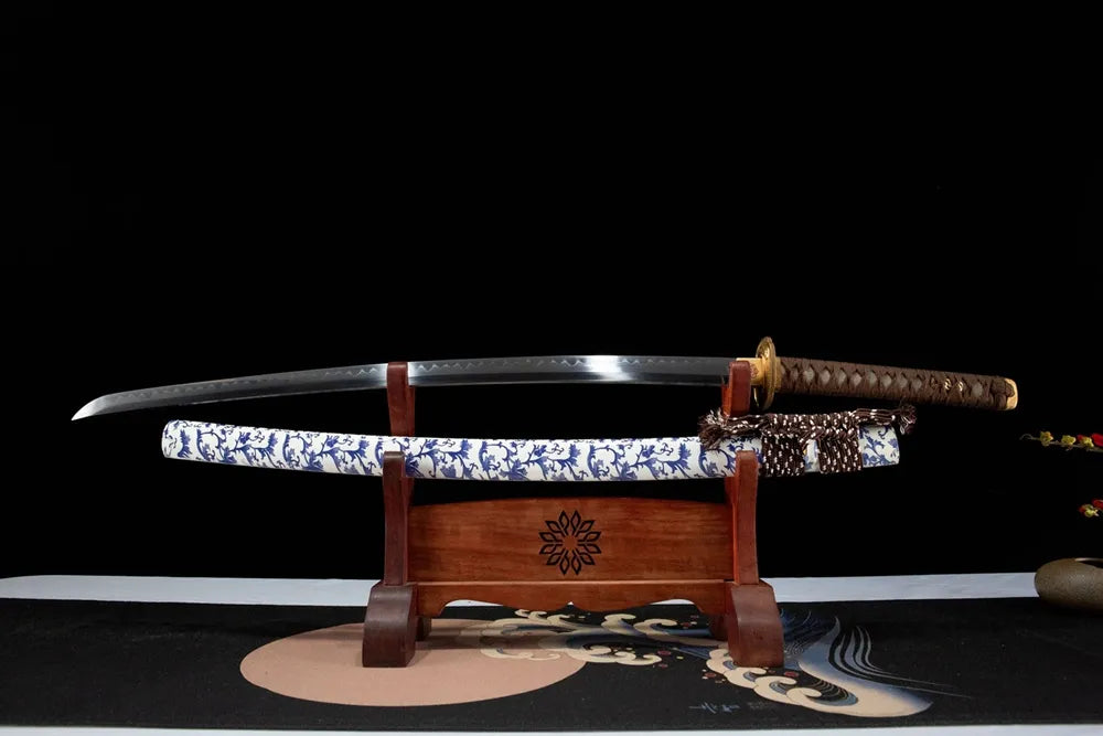 Unsheathed Blue White Porcelain horizontal shot T10 gunome wave hamon maru polished blade