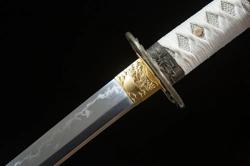 Upper blade closeup Snow Prunus Mume Katana, neat sanbonsugi hamon near golden trim alloy habaki