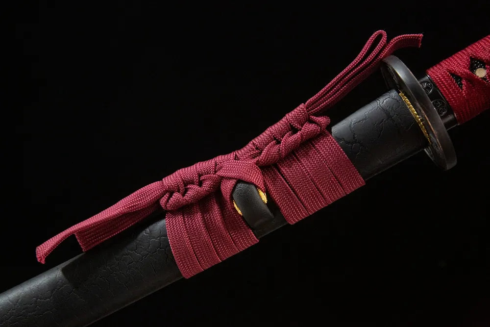 Deep red woven cotton sageo cord tied around saya ring of Mingyuan Katana