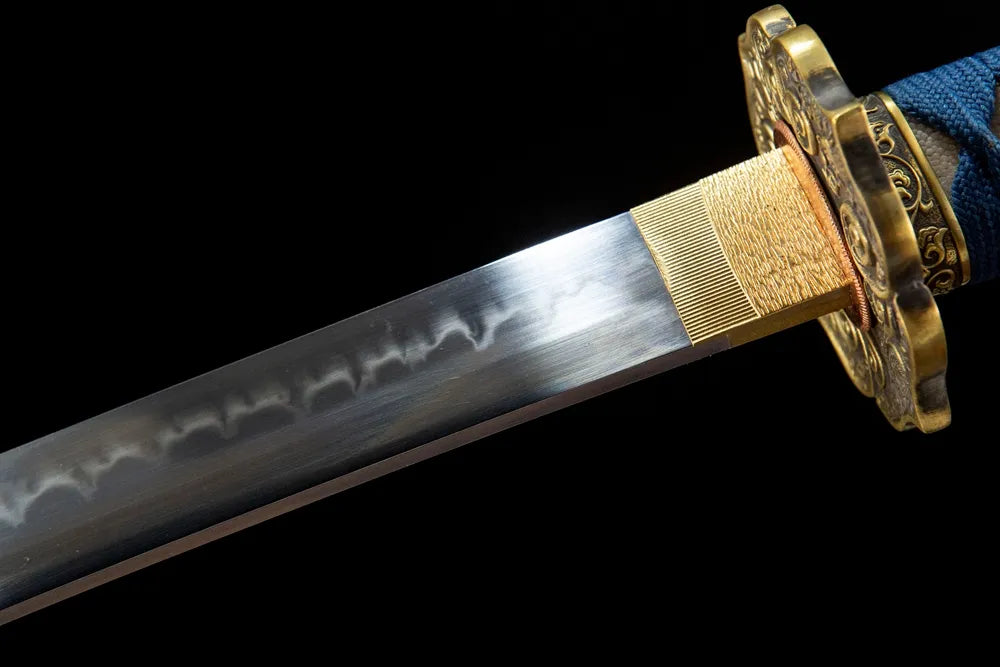 Upper blade closeup Buddha Lotus neat gunome hamon near solid copper habaki