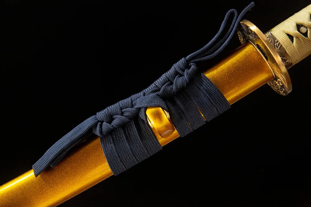 Dark blue coarse cotton sageo cord tied on golden double dragon saya kurikata ring