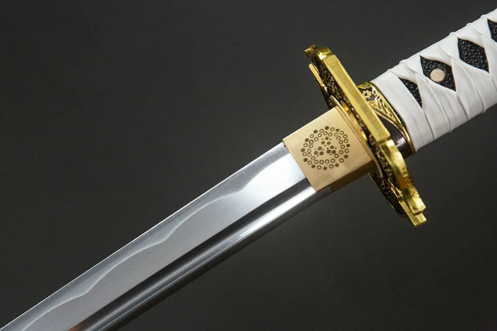 Upper blade closeup Yamato Katana smooth oil quenched steel near solid copper habaki