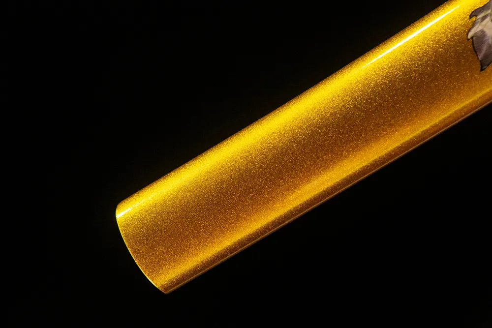 Bottom saya closeup smooth glitter golden solid wood sheath end cap