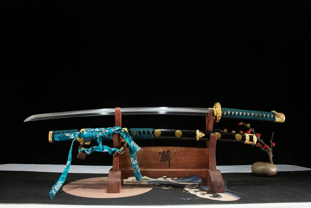 Unsheathed Chrysanthemum Pattern Tachi, T10 steel blade with Gunome hamon
