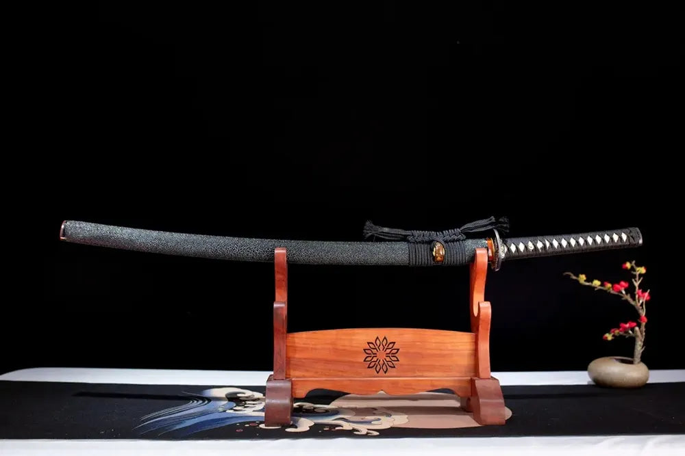 Horizontal laid closed charcoal‑grey silver‑tiger‑stripe Silver‑Tiger‑Katana scabbard flat table‑top front display