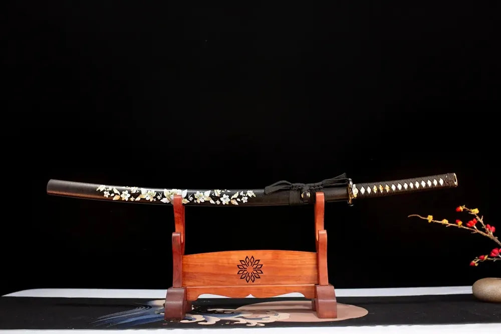 Horizontal laid closed dark‑brown mother‑of‑pearl‑inlaid peony Peony‑Katana scabbard flat table‑top front display