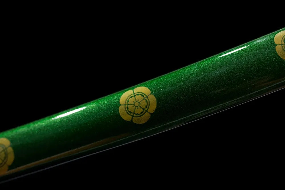 Mid‑section green‑gradient lacquer hardwood tachi saya sakura‑river landscape‑print texture close‑up