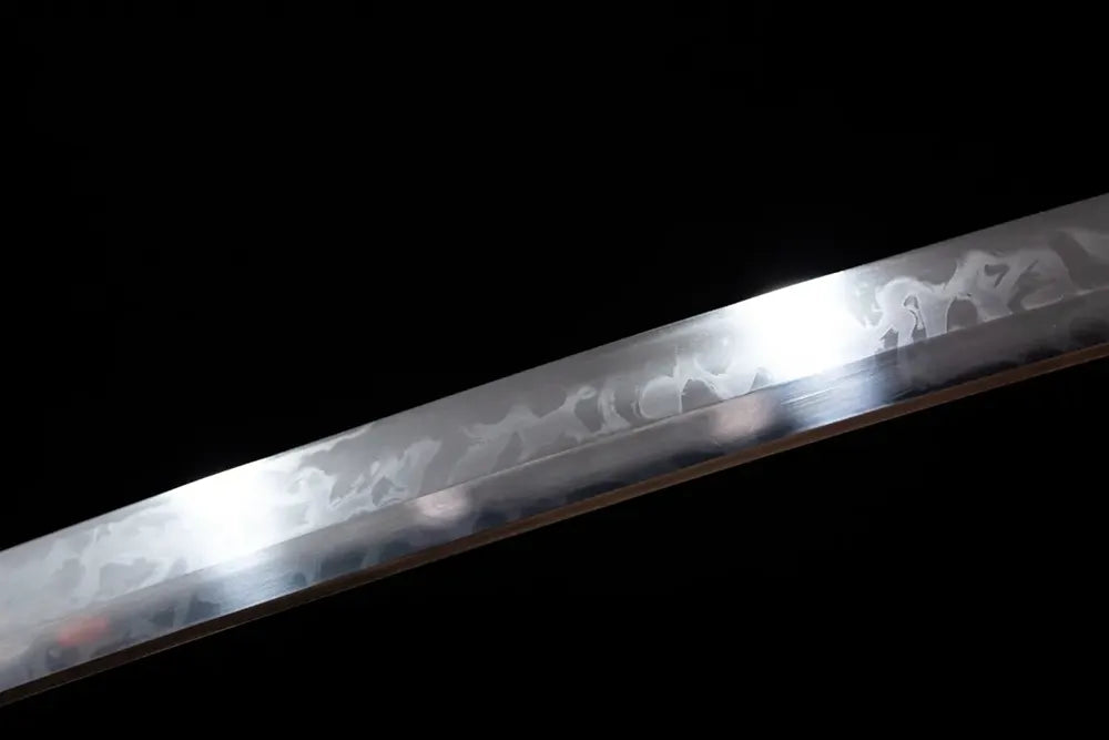 Mid‑section gunome‑choji peacock‑plumage layered‑serrated‑pattern hamon steel katana blade surface close‑up shot