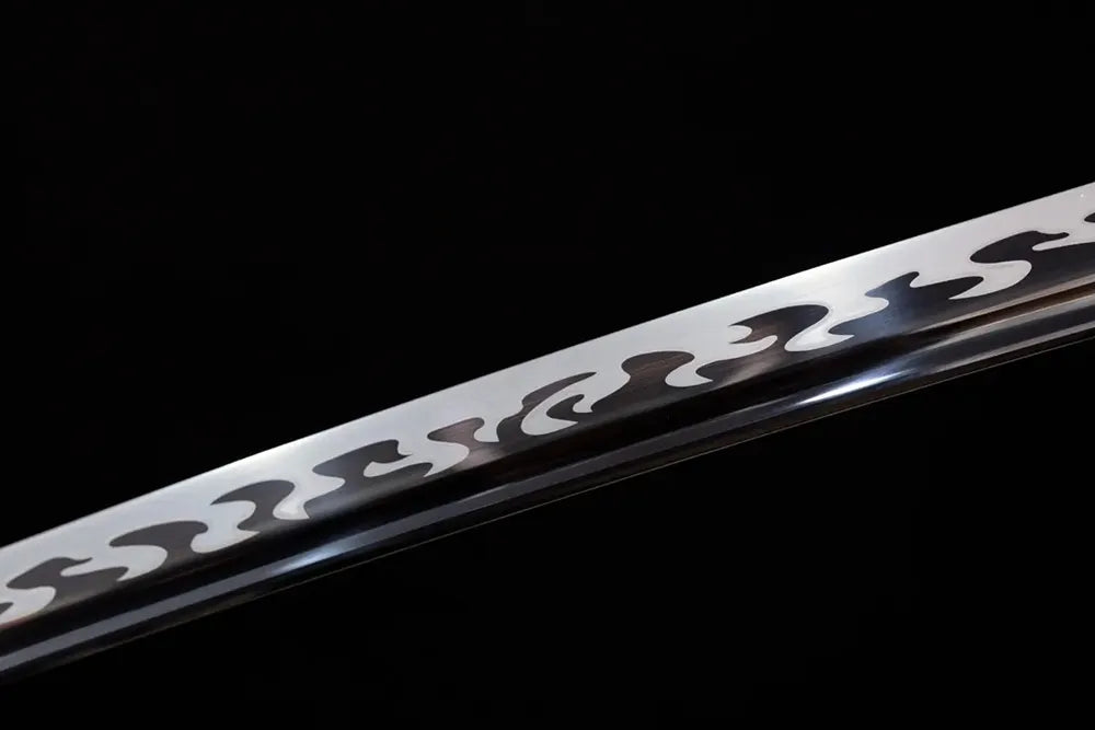 Mid‑section taganeha baked‑black darkened steel katana blade surface close‑up shot