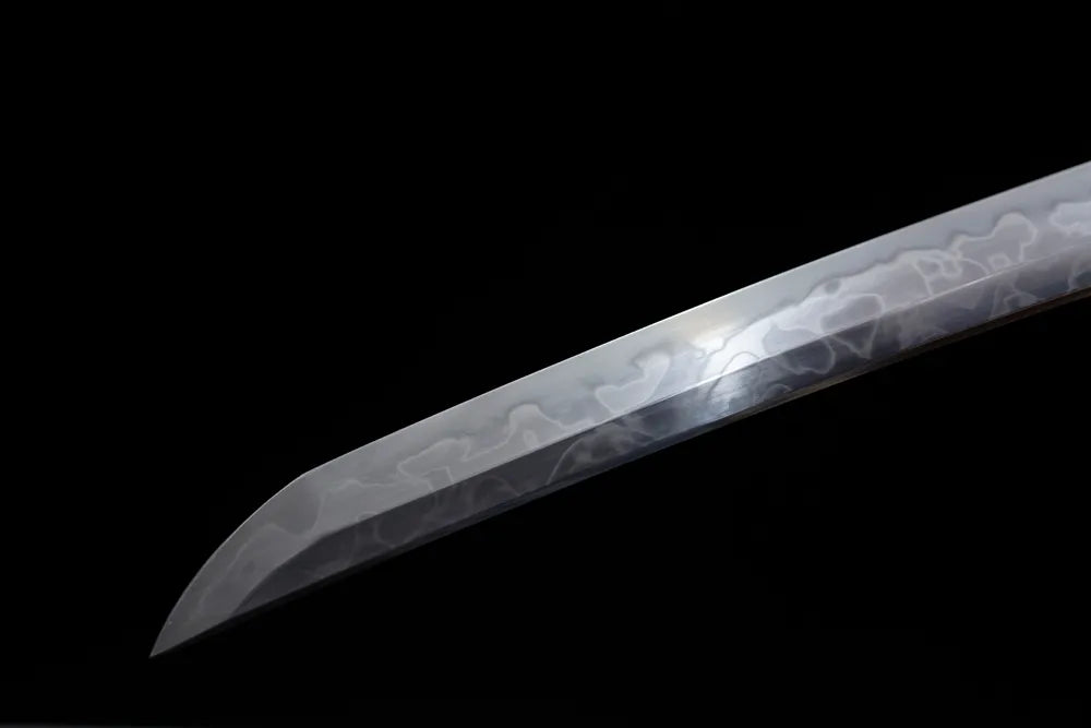 Compact functional wakizashi‑style kissaki tip of Green‑Demon‑Wakizashi blade close‑up view
