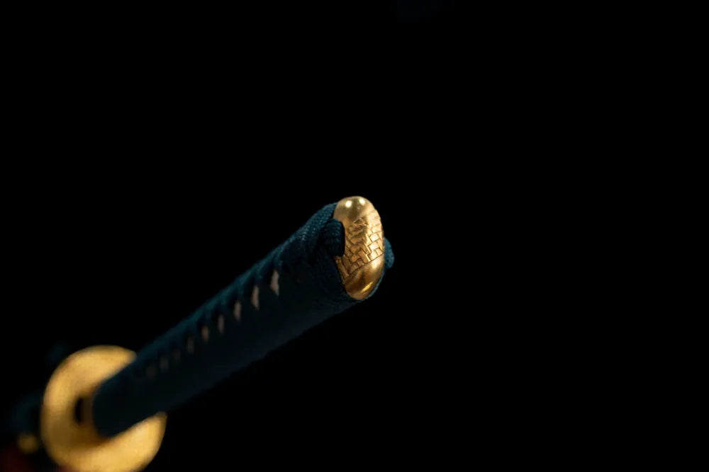 Cloud‑motif antique‑bronze pommel‑cap detail shot