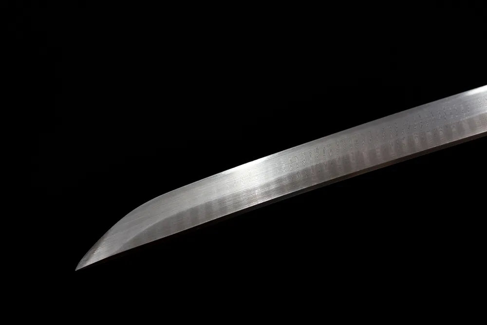 Classic functional katana‑style kissaki tip of Supreme‑Katana blade close‑up view