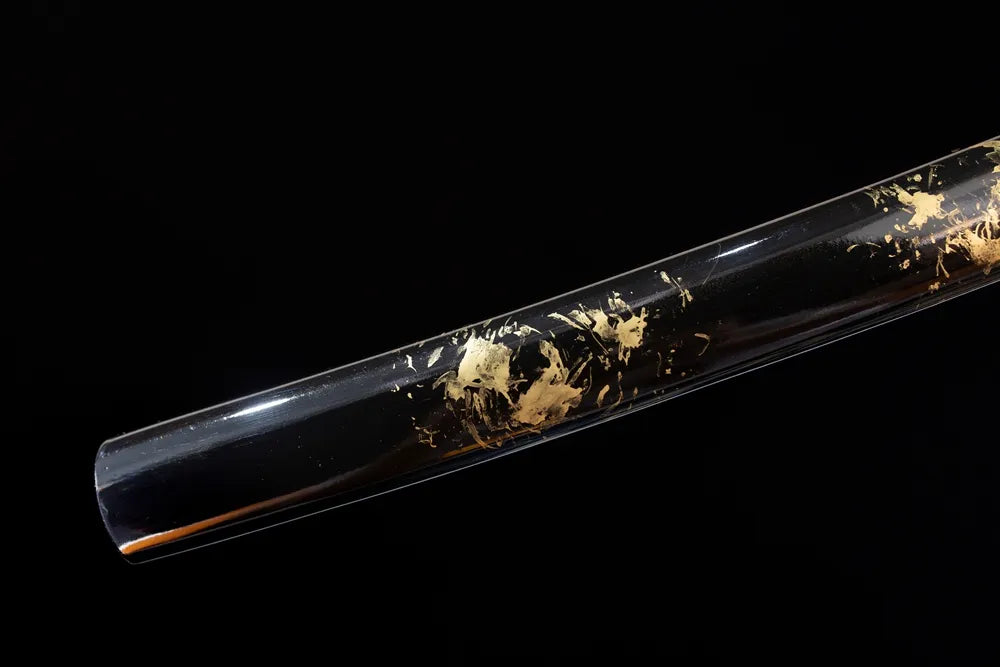 Bottom jet‑black saya aged‑bronze kojiri end‑cap close‑up