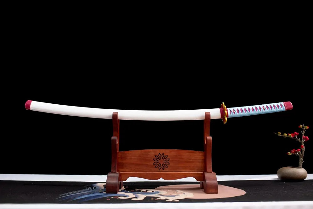 Horizontal laid closed glossy white Mitsuri scabbard flat table‑top front display