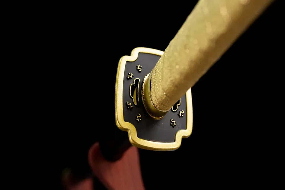 Reverse engraved‑symbol golden alloy tsuba surface texture