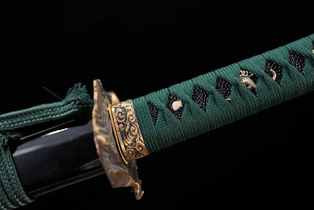 Grasshopper‑leaf‑relief aged‑teal‑bronze fuchi grip‑ring macro close‑up