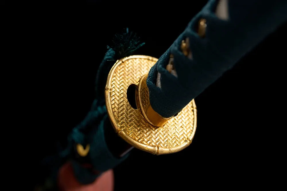 Reverse side cloud‑carving antique‑bronze tsuba surface texture close‑up