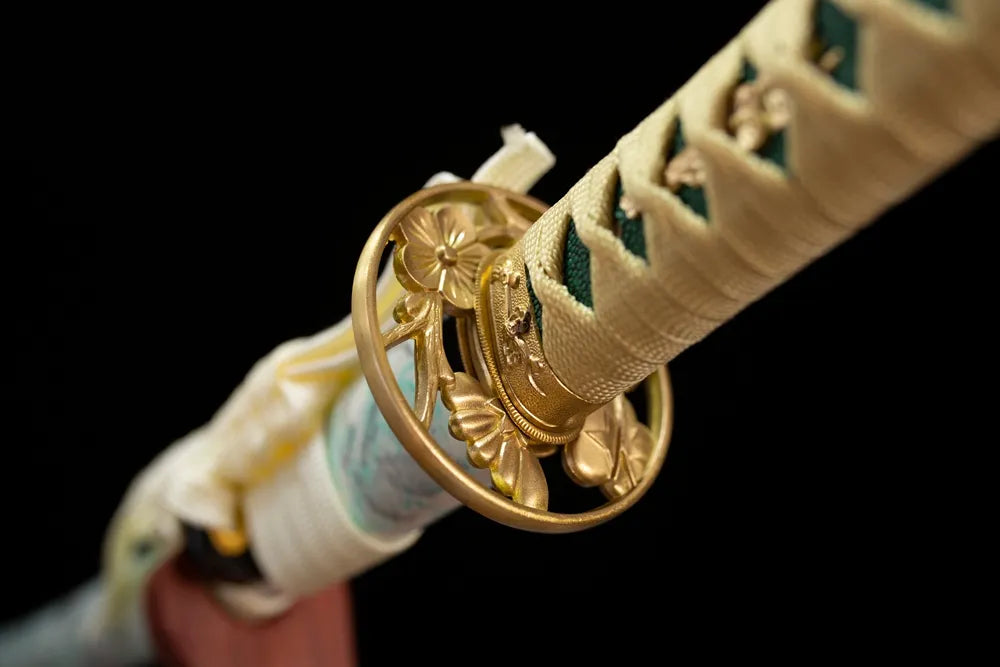 Reverse‑side winter‑plum‑flower carving gilded‑alloy tsuba surface texture close‑up