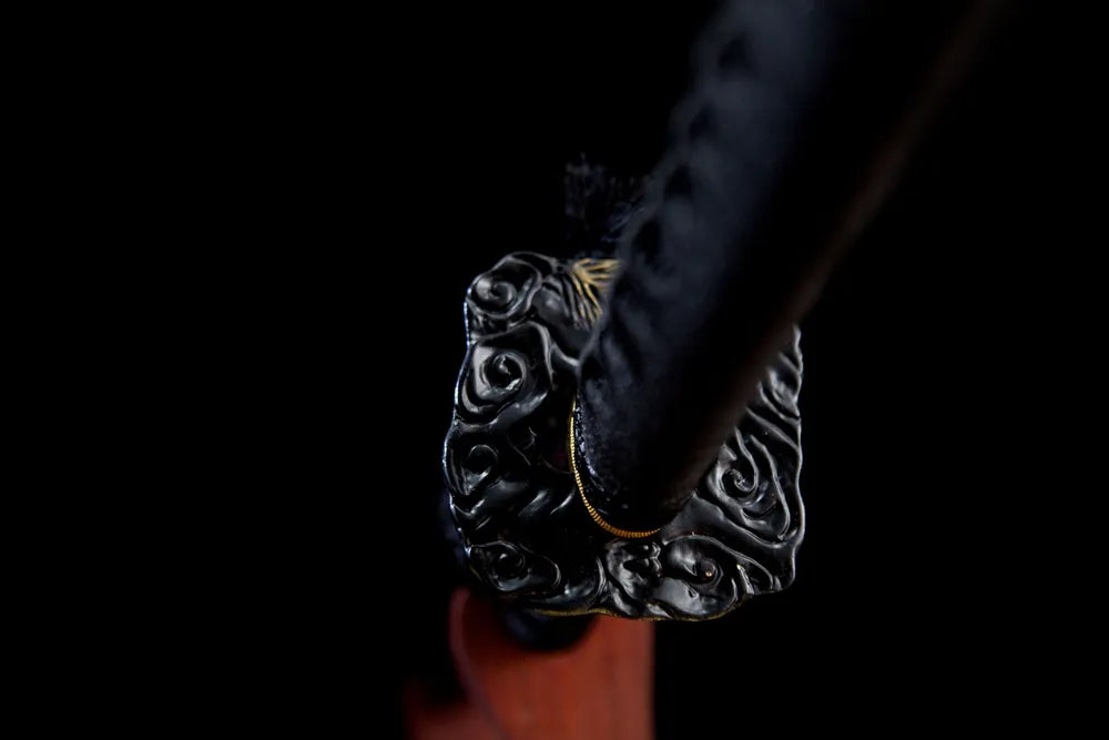Reverse cloud pattern black alloy tsuba