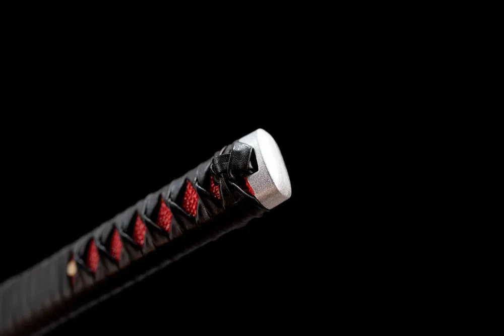 Red accent alloy fuchi tsuka collar macro close‑up front view
