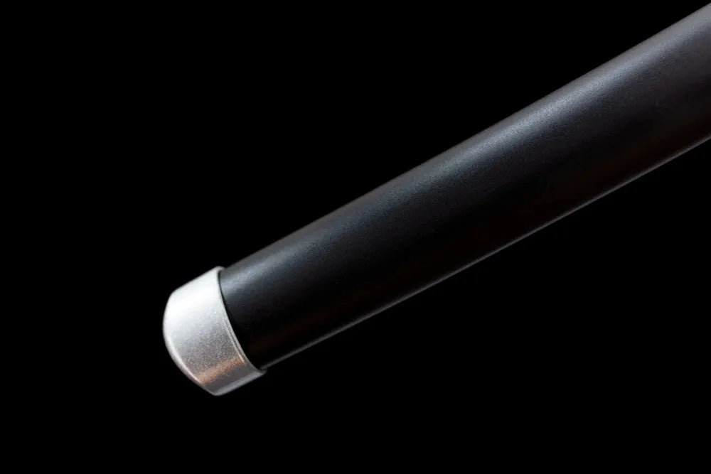 Bottom pale saya pale‑tone alloy end‑cap close‑up