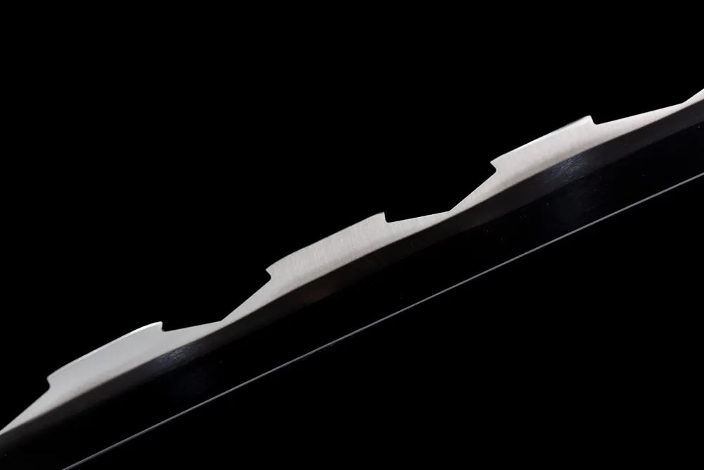 Mid‑section serrated beast‑style steel blade tooth texture surface close‑up