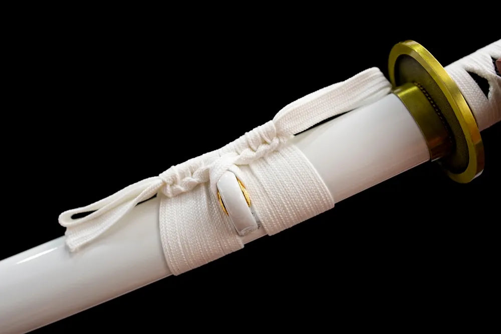 Thin off‑white braided sage cord brass fitting macro close‑up