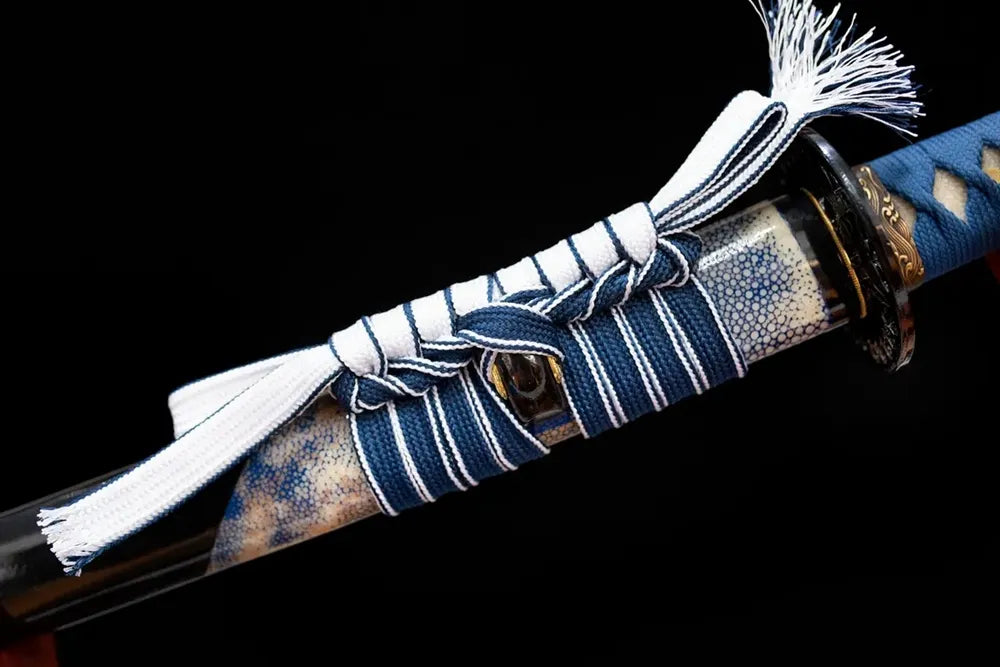 Thick white‑blue mixed‑braided sageo cord brass fitting macro close‑up