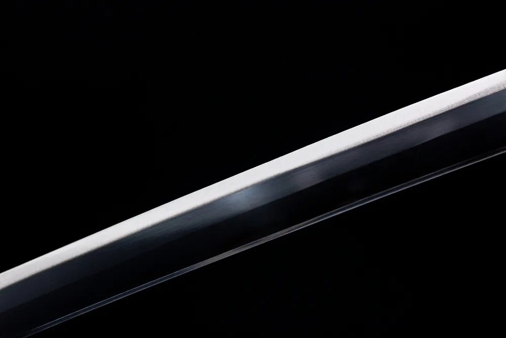Mid‑section plain polished carbon‑steel blade texture shot