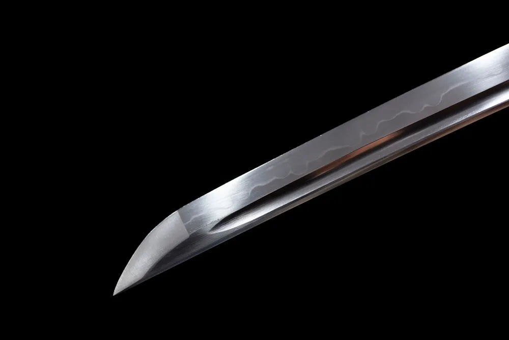Short‑style wakizashi kissaki tip with hamon trace close view