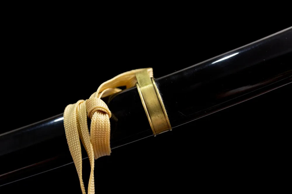 Thin black narrow braided sage cord silver fitting macro close‑up