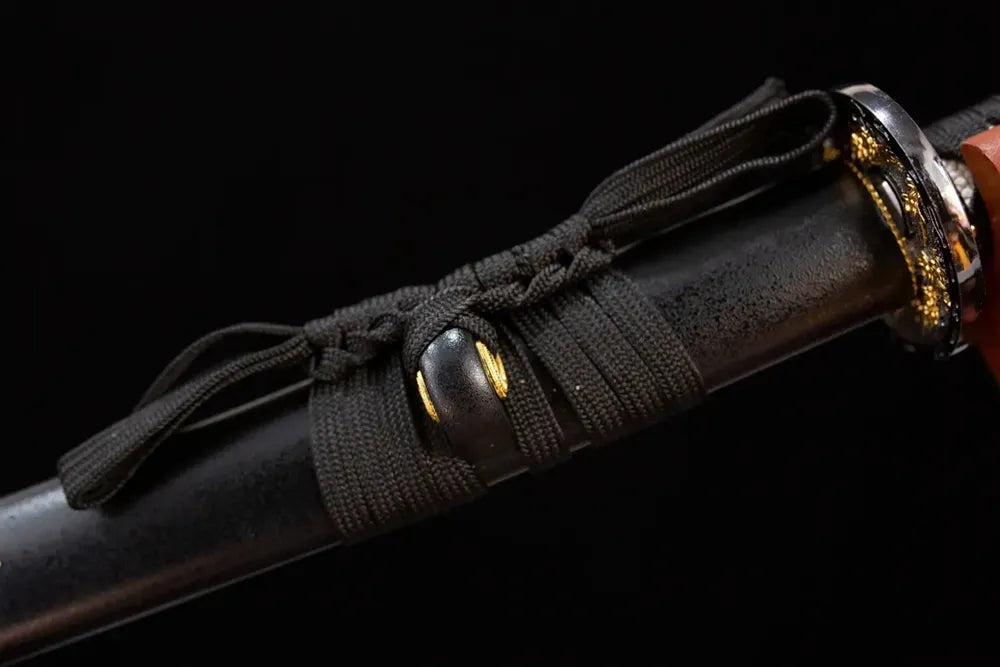 Thick black‑braided sageo cord gilded‑zinc‑alloy fitting macro close‑up