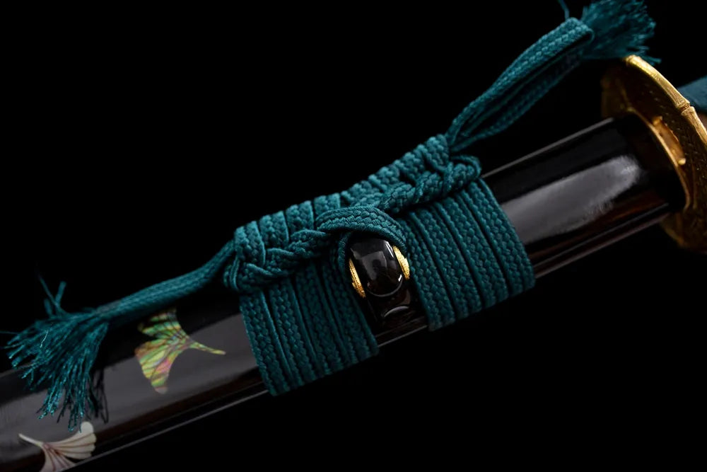 Thick dark‑grey‑black mixed braided sageo cord antique‑bronze fitting macro close‑up