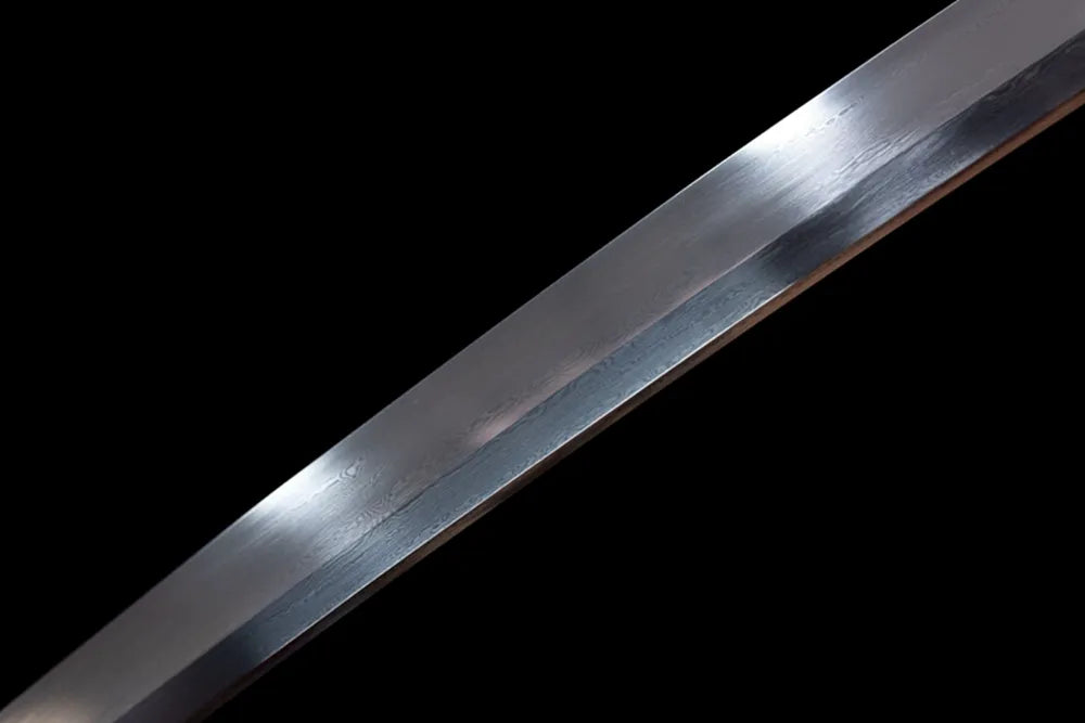 Mid‑section damascus layered folded grain steel blade surface texture close‑up shot