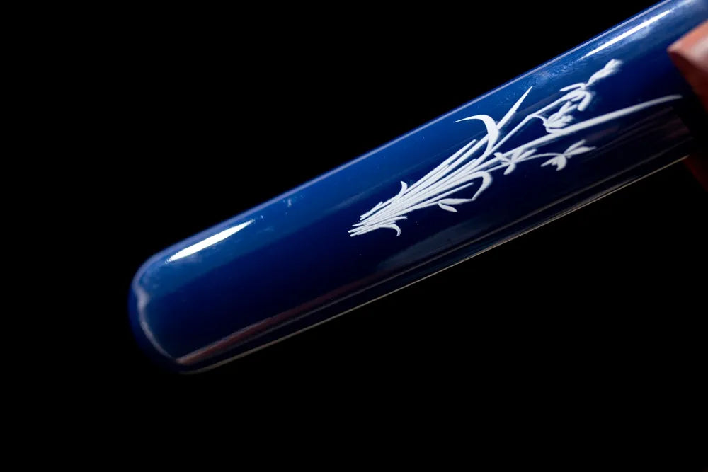 Bottom cyan‑gradient bamboo‑pattern saya antique‑bronze alloy kojiri end‑cap close‑up