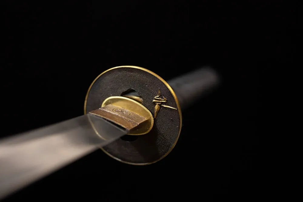 Front open‑work origami‑paper‑crane‑3d‑relief copper‑brass katana hand‑guard close‑up