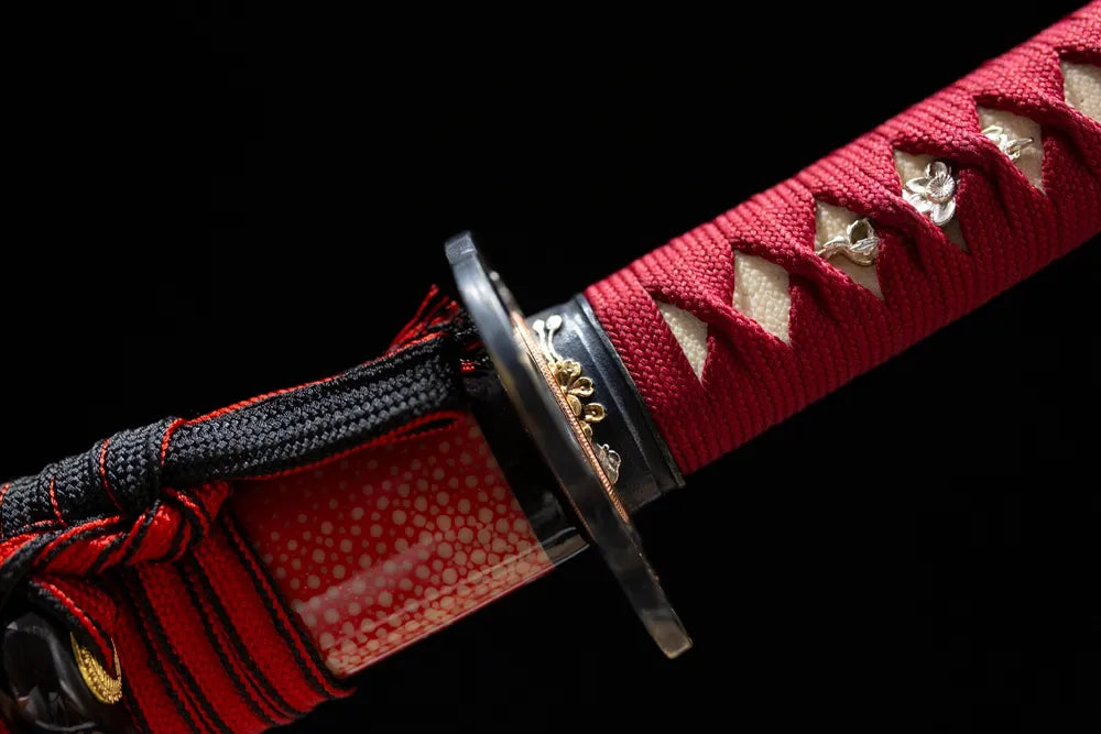 Red‑plum‑floral‑relief black‑gold gilded fuchi grip‑ring macro close‑up