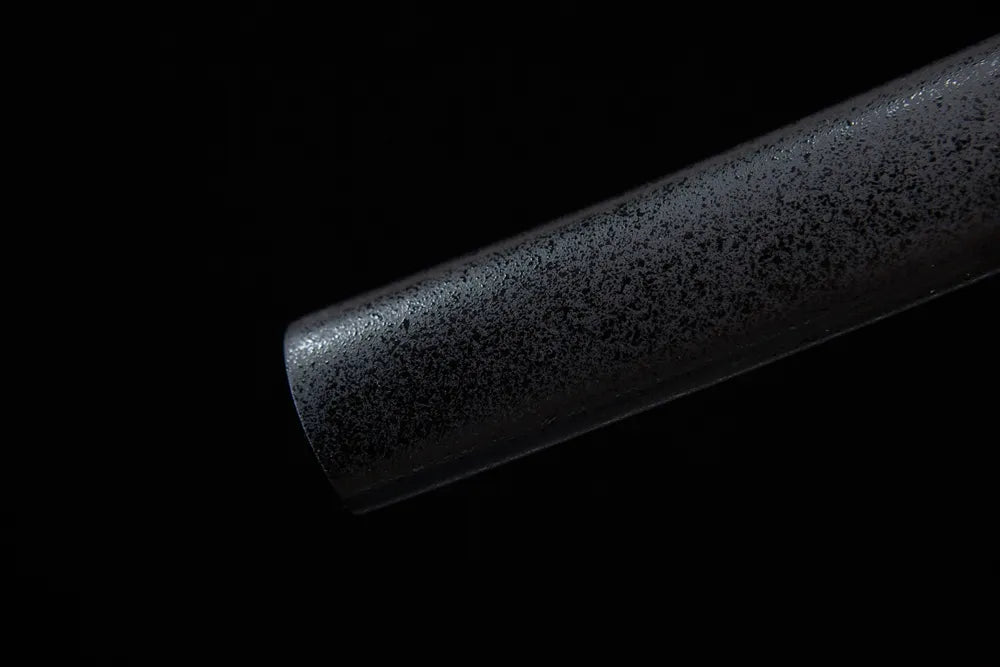 Bottom end of compact black scabbard