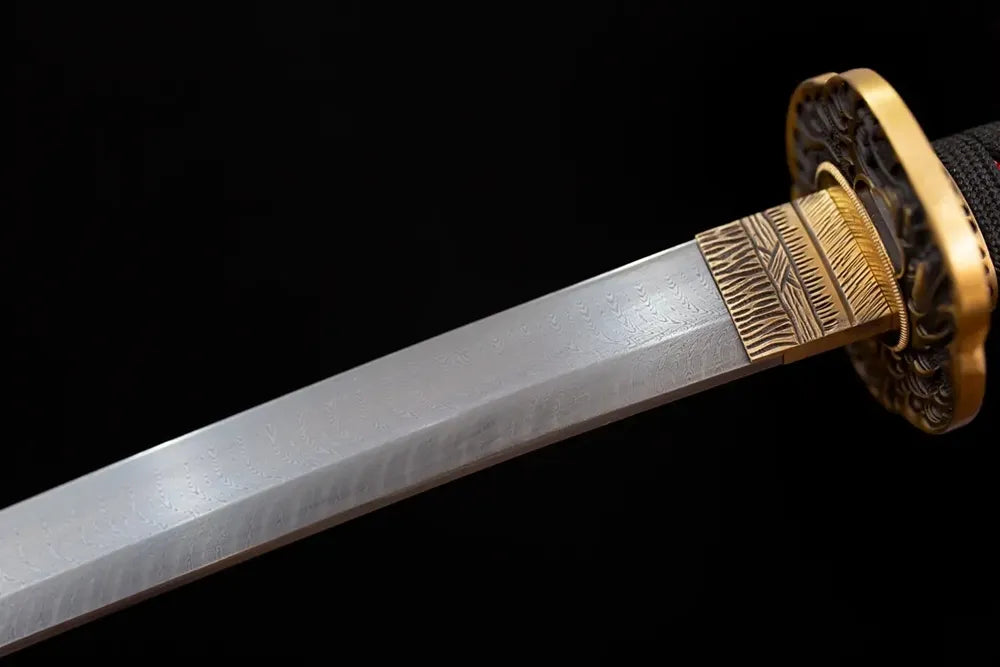Upper T10 clay‑tempered katana blade brass habaki billowing cloud‑surge undulating hamon temper‑line macro close‑up