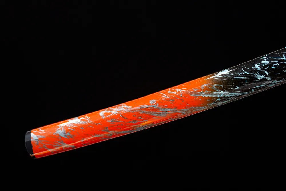 Bottom orange‑red‑gradient saya black‑alloy kojiri end‑cap close‑up