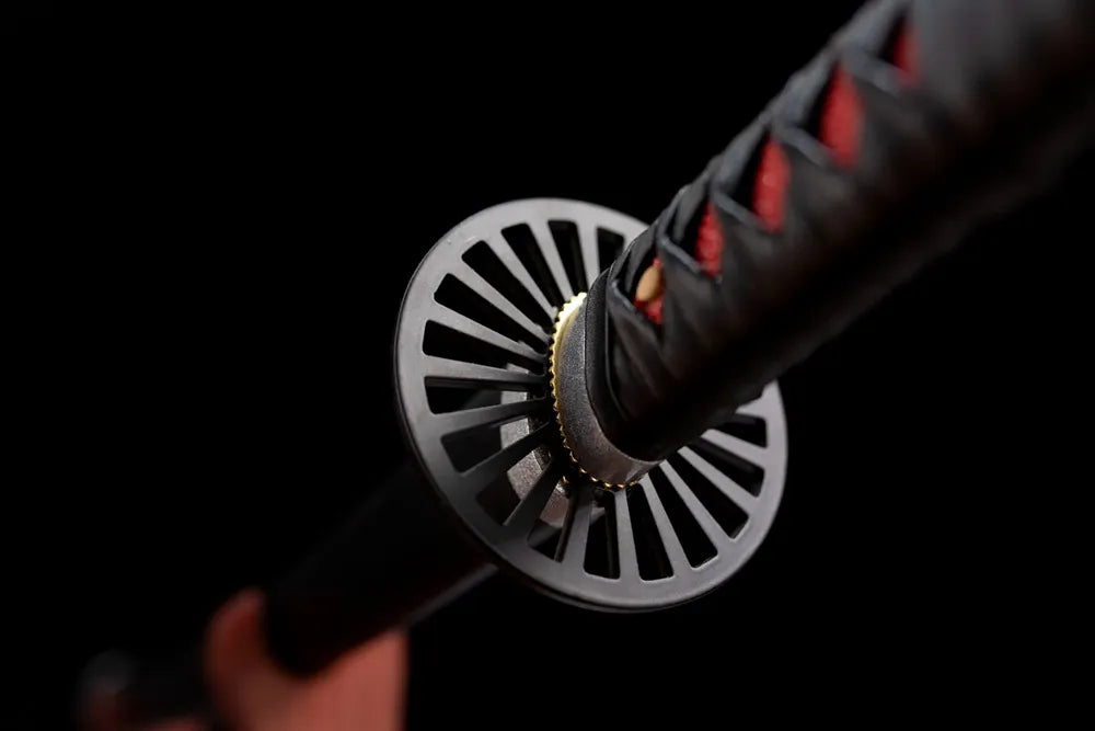 Reverse back side of red‑ring tsuba alloy surface close‑up
