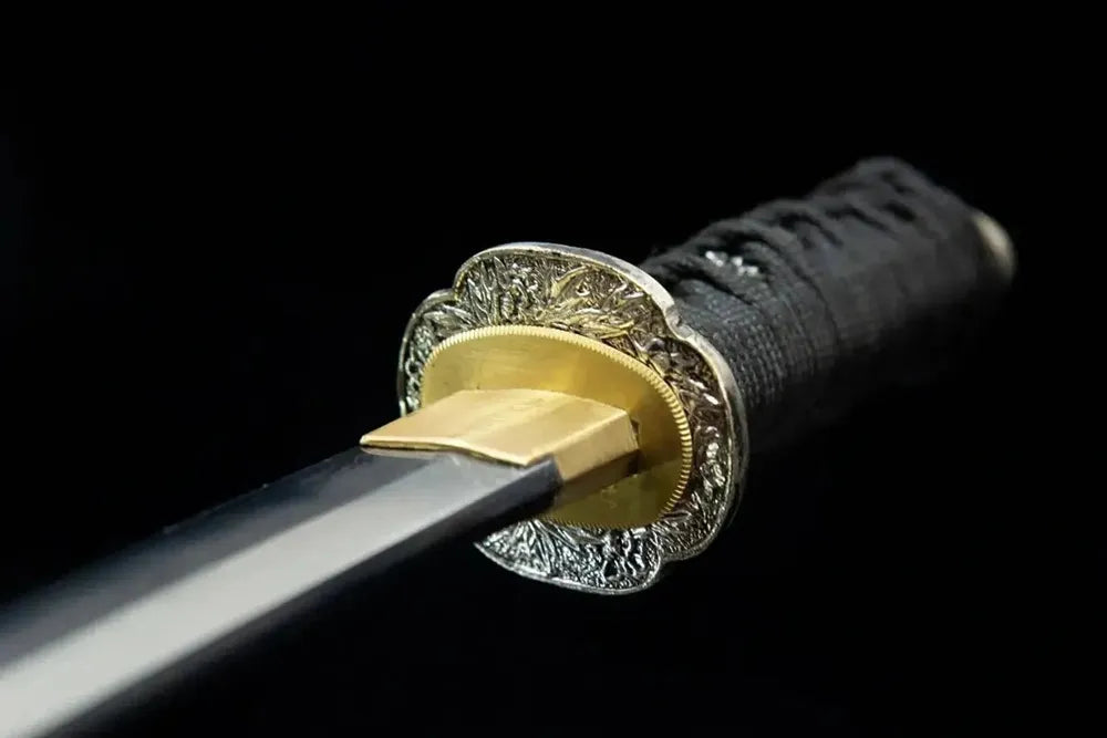 Front carved silver tsuba hand guard