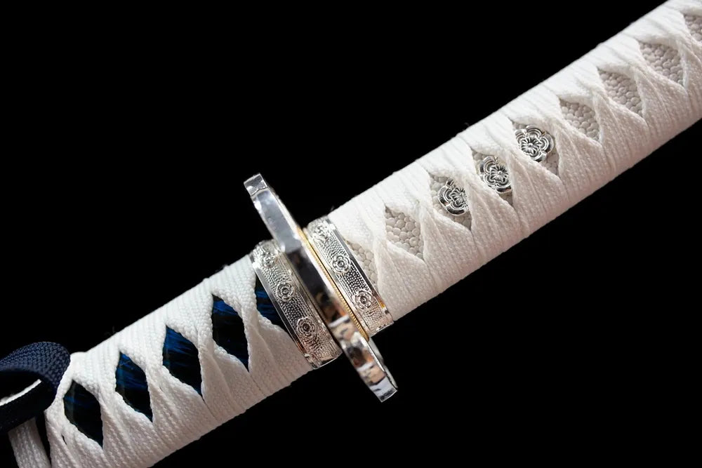 Floral‑mon engraved silver‑toned alloy fuchi grip‑ring macro close‑up