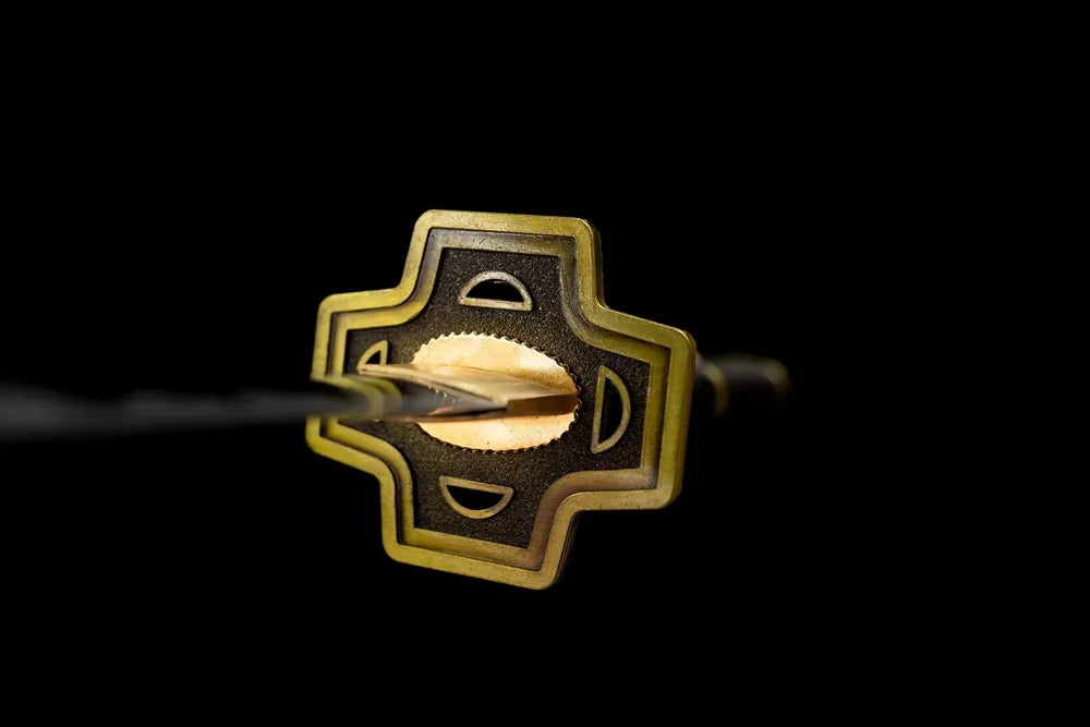 Front geometric hollow cut‑out antique brass anime hand‑guard close‑up