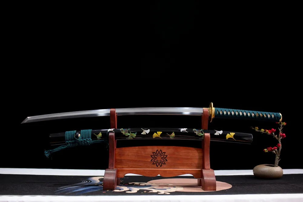 Flat fully‑drawn T10 clay‑tempered ink‑cloud‑etched Ink‑Style‑Katana blade wooden rack front shot