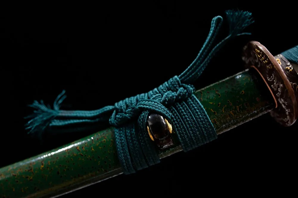 Thin green‑black mixed braided sageo cord brass‑alloy fitting macro close‑up