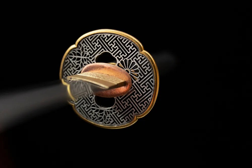 Front open‑work floral‑relief copper gilded‑silver katana hand‑guard close‑up